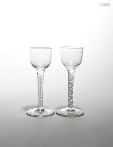 Two wine glasses c.1760-70, with small rounded funnel bowls raised on double series opaque twist