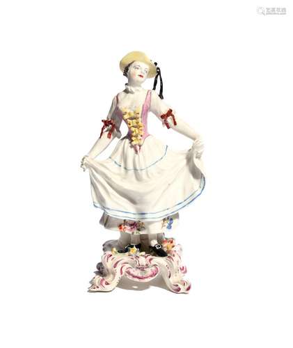 A Bow figure of a dancer c.1760, after a Meissen model of Columbine, standing on a footed base