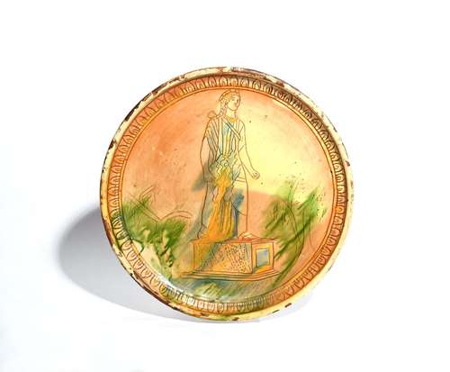 A slipware sgraffito charger 19th century or earlier, with incised decoration of a statue of Diana