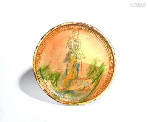 A slipware sgraffito charger 19th century or earlier, with incised decoration of a statue of Diana