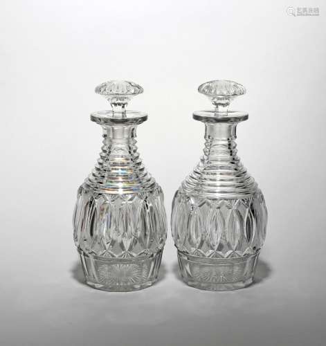 A good pair of cut glass decanters and stoppers early 19th century, the ovoid bodies cut with a wide