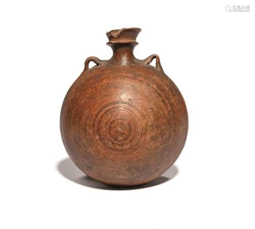 A pottery costrel or pilgrim flask probably medieval 14th-16th century, of rounded form with light