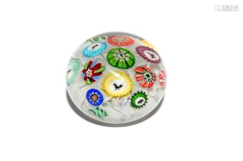 A Baccarat spaced millefiori paperweight dated 1848, set with thirteen individual canes including