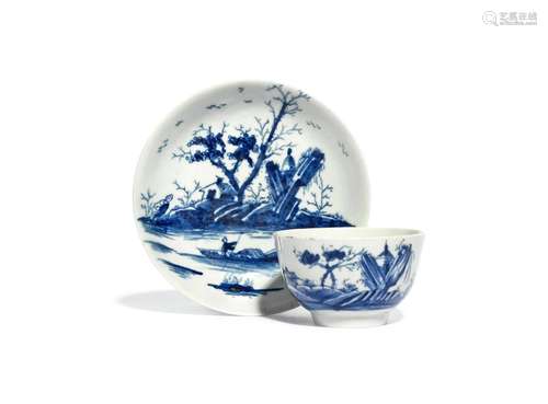 A Worcester blue and white teabowl and saucer c.1755-58, painted with the Gazebo pattern, a small