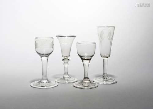 Four wine and ale glasses c.1740-50, the ale with a slender bowl engraved with hops and barley,