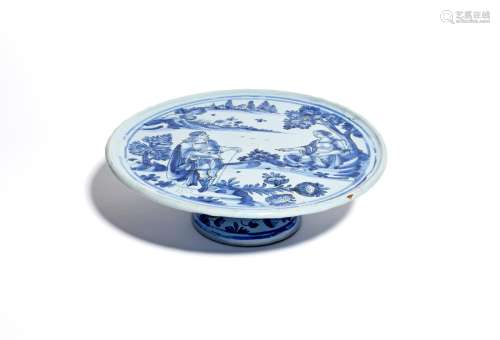 A French (Nevers) faïence tazza late 17th century, the circular top painted in blue with a maiden
