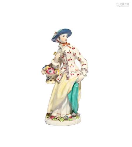 A Bow figure of a Flower Girl c.1755-60, modelled with a basket of flowers suspended from the