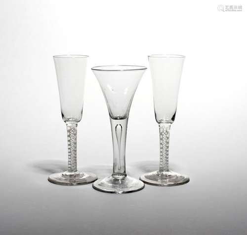 A pair of large wine fluted or ale glasses c.1760, the tall slender bowls raising from double series