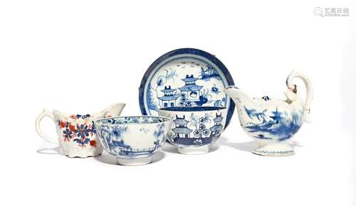 A Lowestoft blue and white teabowl and saucer c.1780, painted with a Chinese pagoda landscape, a