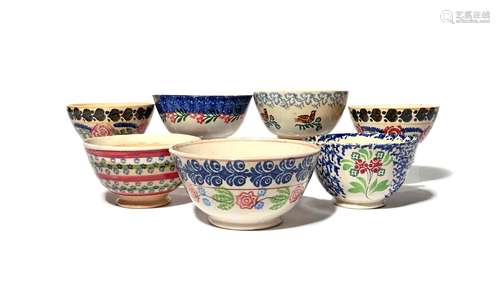 Seven spongeware bowls 19th/20th century, variously decorated in shades of red, blue and green