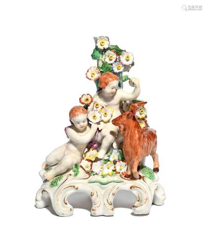 A Plymouth figure group c.1770, modelled with two putti and a goat before flowering bocage, entwined