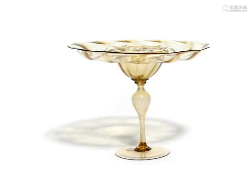 A façon de Venise tazza late 16th/17th century, the fine glass of a pale yellow hue, the wide