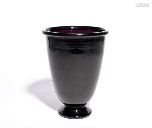 A large amethyst glass vase c.1800, the tall rounded funnel form of a rich purple tone, raised on