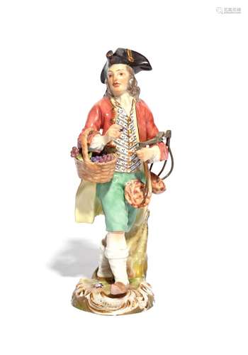 A Meissen Cris de Paris figure of a grape seller 19th century, after the model by Peter Reinicke,