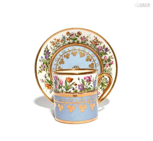 A Sèvres coffee can and saucer c.1816, painted with the garden (le jardin) pattern of flowering