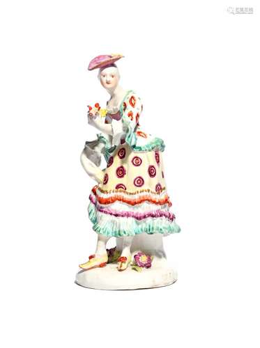 A Derby figure of a dancing shepherdess c.1760-65, a small posy in her extended left hand, holding