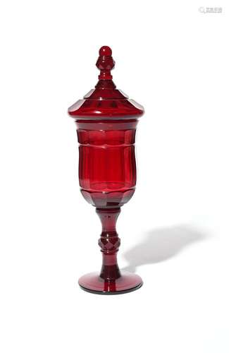 A large Bohemian glass goblet and cover 19th century, of a rich ruby colour, the faceted bowl raised