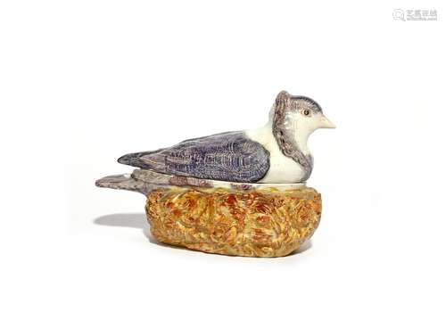 A pearlware 'capuchine pigeon' tureen and cover late 18th/early 19th century, after Derby, seated on