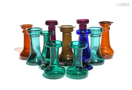 Eleven large glass hyacinth vases 19th/early 20th century, of traditional churn shape, some with a