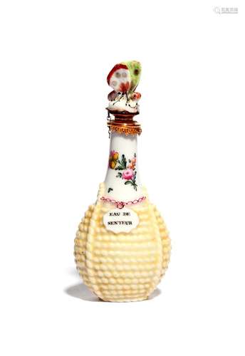 A Chelsea scent bottle c.1755, modelled as a bottle contained in a yellow wicker basket, the neck