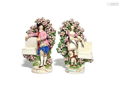 A matched pair of Derby sweetmeat figures c.1760-65, modelled as a young man and his companion