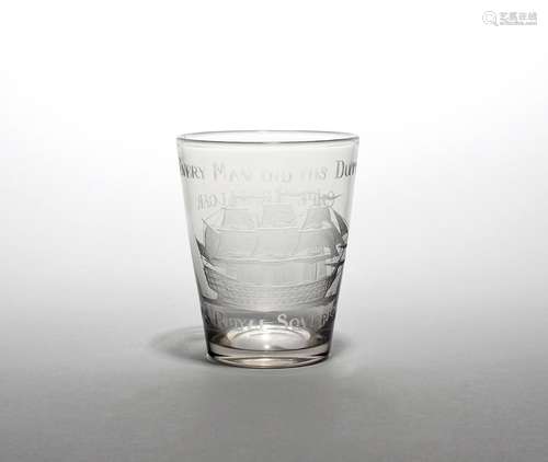 A commemorative glass beaker of naval interest dated 1805, the flared form engraved with a ship at