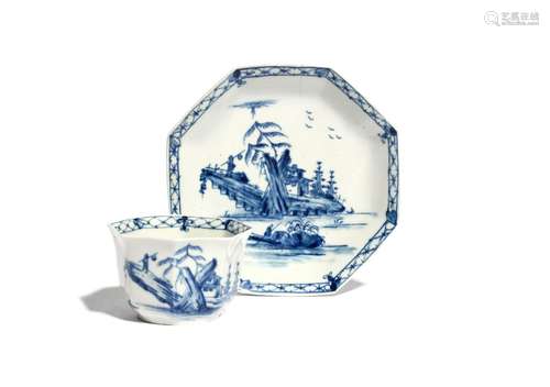 A Worcester blue and white octagonal teabowl and saucer c.1756, painted with the Romantic Rocks