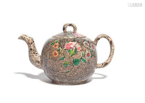 A Staffordshire salt-glazed stoneware teapot and cover c.1760, the globular body painted with a