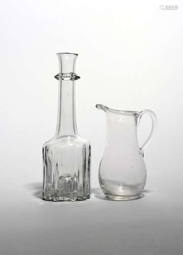 A cruciform decanter or serving bottle c.1740, the heavy base rising to a tall neck with slightly