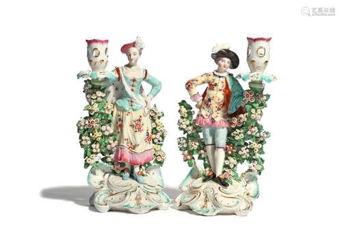 A pair of Derby candlestick figures of the Ranelagh Dancers c.1760-65, each standing with one hand