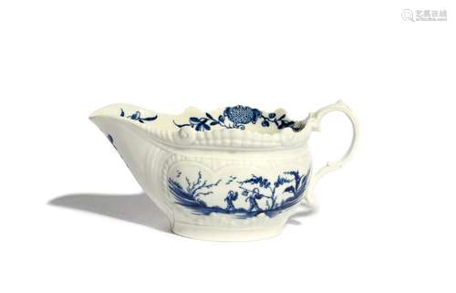 A Worcester blue and white sauceboat c.1770, painted with the Two Porter Landscape pattern, the