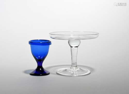 A small glass tazza mid 18th century, the shallow bowl raised on a plain stem with a slight baluster