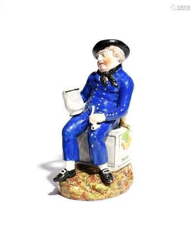 An American Sailor Toby jug c.1820, wearing a blue uniform with yellow buttons and seated on a sea