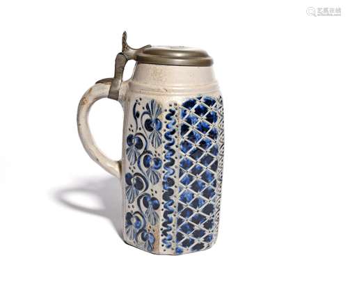 A Westerwald stoneware tankard dated 1786, the tall hexagonal form incised with flowering tendrils