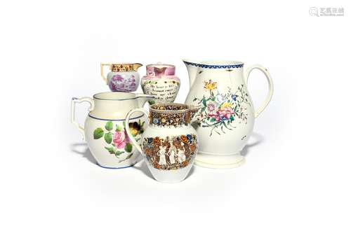 Five pearlware jugs 19th century, the largest painted with loose sprays of polychrome flowers,