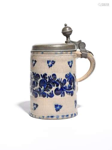 A Westerwald stoneware tankard 18th century, the cylindrical form incised and decorated in blue with