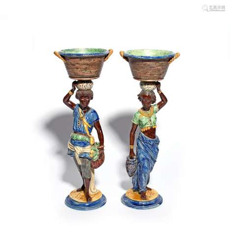 A large pair of Continental Majolica sweetmeat figures 19th century, each modelled as a standing