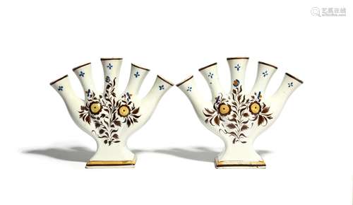 A pair of Pratt ware quintals early 19th century, each formed of five splayed narrow vases issuing