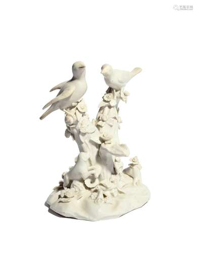 A Bow white-glazed figure of birds in branches c.1755, modelled with two finches perched on