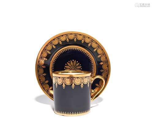 A Sèvres coffee can and saucer dated 1814, decorated with a formal gilt border of palmettes and