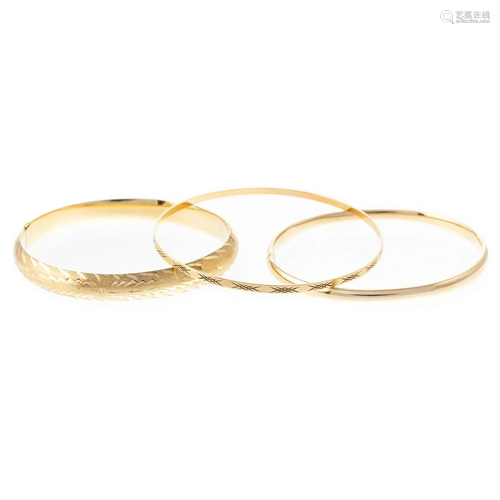 A Trio of Bangle Bracelets in 14K