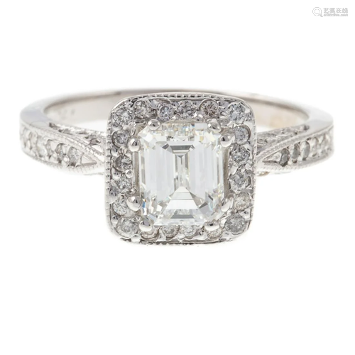 A 1.08 ct Emerald Cut Diamond Halo Ring in 14K