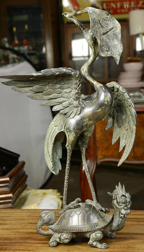 A Japanese figural sculpture of a crane