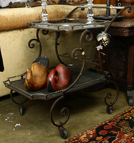 A modern wrought metal serving cart