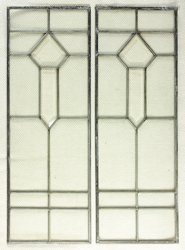 Pair of beveled and leaded glass windows