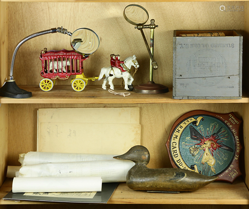 Two shelves of decoratives and U.S. Navy documents