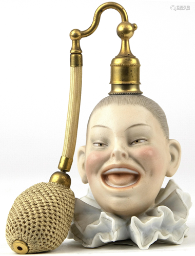 A Continental porcelain bisque figural perfume bottle