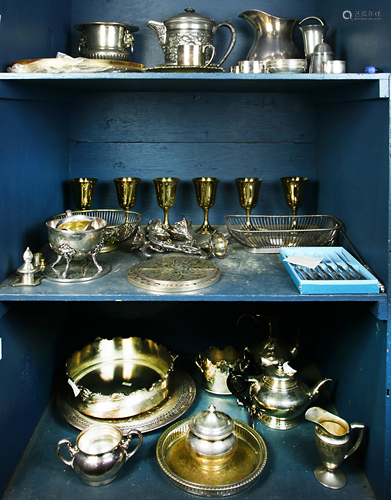 Three shelves of associated silverplate table articles