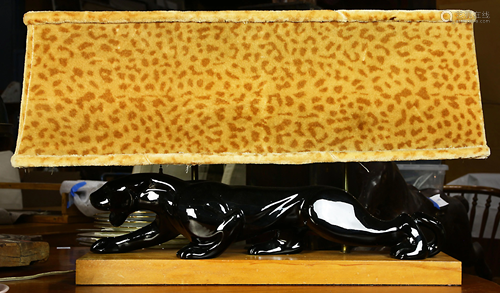 A 1950s black leopard figural lamp