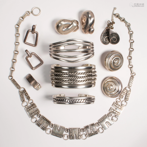 A group of silver jewelry